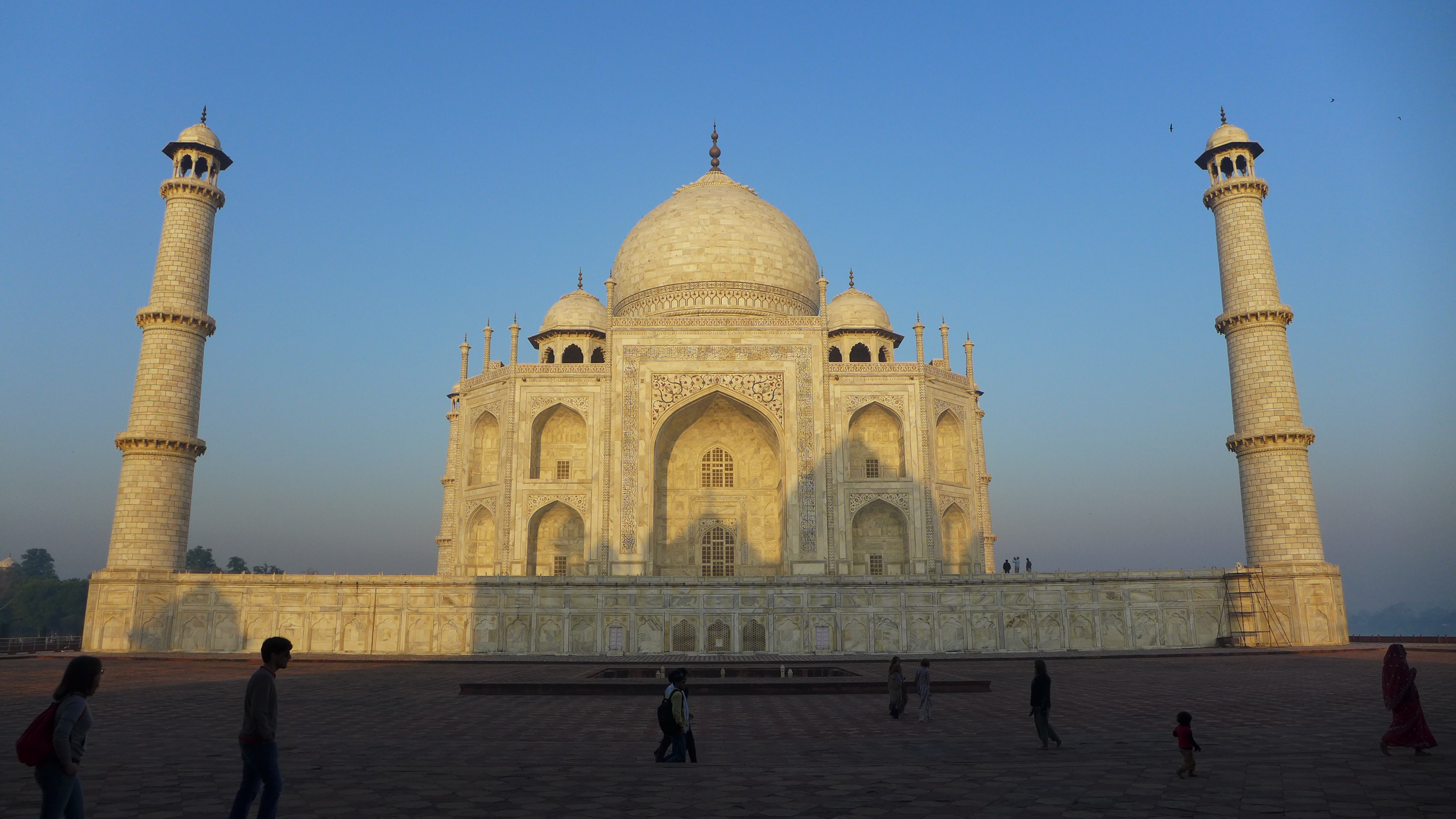 East side of the Taj at sunrise. The minarets appear to tilt inward, but it is an optical illusion, exaggerated by the lens of the camera. The towers actually, lean slight outward, as was designed by the builders to protect the monument from a falling minaret in the even of an earthquake. It is known, though that the SW minaret has increased it's tilt in the past sixty years, which is of concern. 